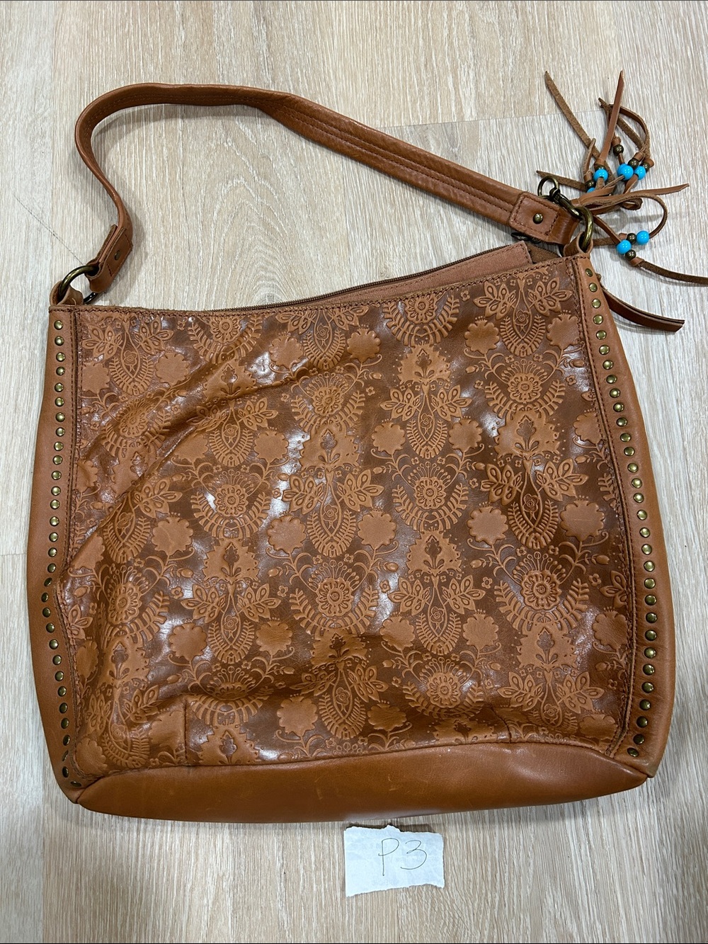 The Sak Brown Embossed Leather Shoulder Bag with Tassel Beads